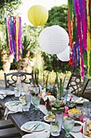 Lanterns above table set in bright colours for Mex