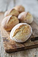 Homemade breakfast rolls on a wooden board