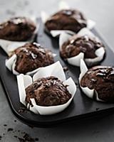 Chocolate muffins in a muffin tin