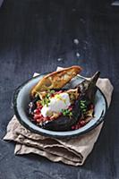 Grilled aubergine with soft cheese and tomato