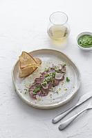 Beef tongue with basil pesto and parmesan