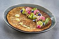 Pancake decorated with vegetables