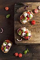 Bruschetta with mozzarella, red onion, strawberry 