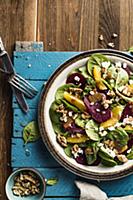 Spinach salad with beets, italian nuts, feta chees