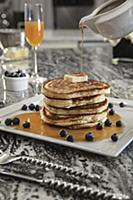 Stack of blueberry buttermilk pancakes with butter