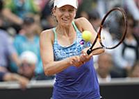 Mona Barthel of Germany returns a ball to Sweden's