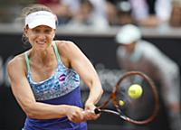 Mona Barthel of Germany returns a ball to Sweden's