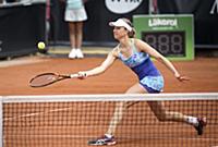 Mona Barthel of Germany returns a ball to Sweden's