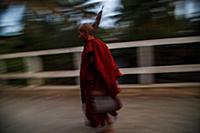 Myanmar / Mrauk U / 2014 / Monk crossing a bridge.