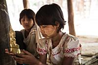 Myanmar / Mrauk U / 2014 / Burmese girl holding a 