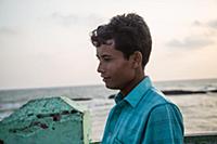 Myanmar / Sittwe / 2014 / Burmese man watching the