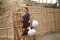 Myanmar / Mrauk U / 2014 / Burmese woman carrying 