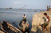 Myanmar / Sittwe / 2014 / Burmese man on a boat. 
