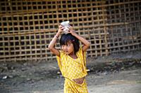 Myanmar / Mrauk U / 2014 / Burmese girl carrying w