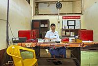 MYANMAR / Mon State / Bago / Stationmaster in his 