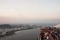 BRAZIL / Rio de Janeiro / Tourists watching the su