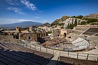 View to the Teatro di Antico of Taormina with Etna