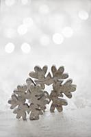 Wooden snowflakes against blurred background